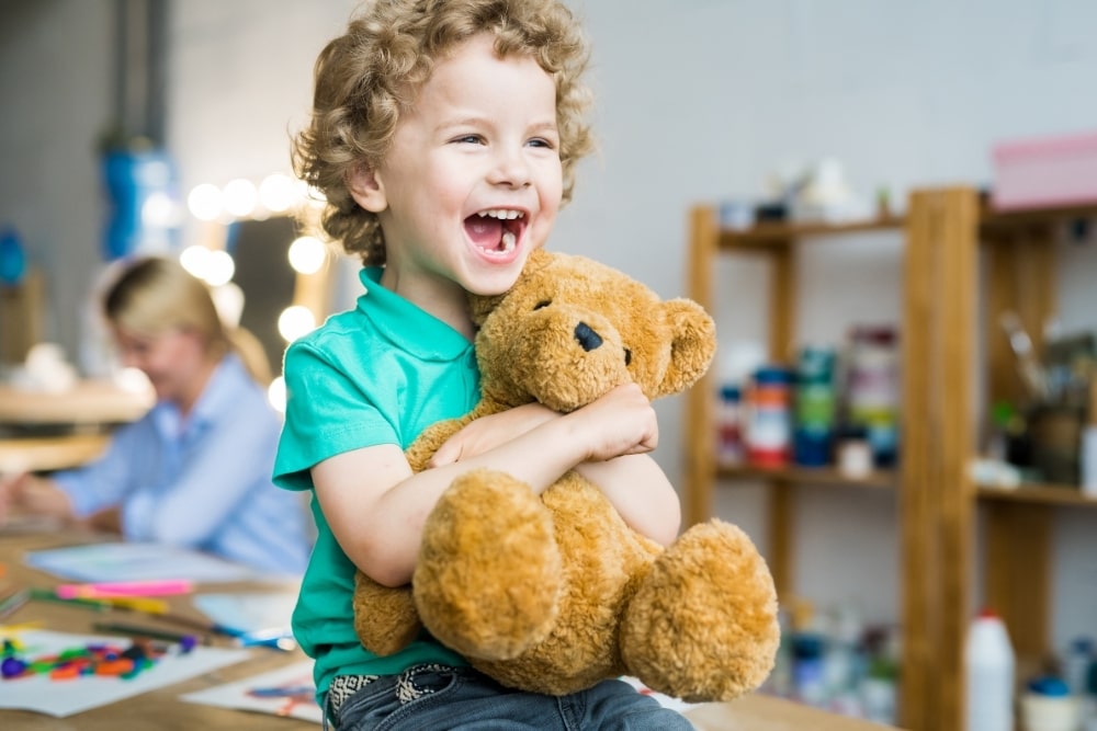 child with teddy