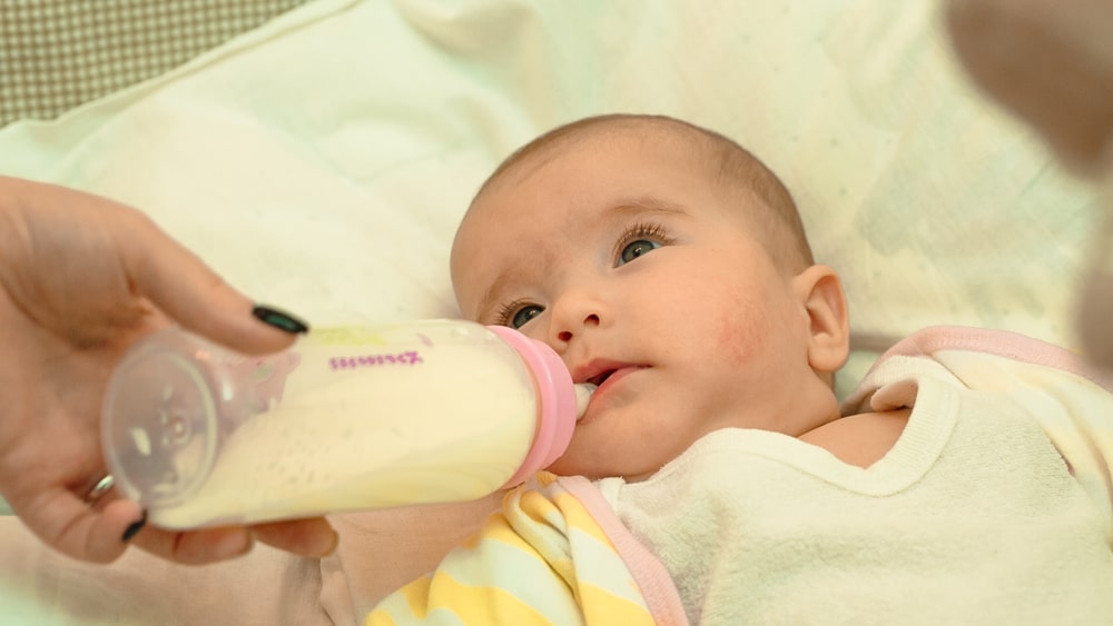 When Do Babies Hold Their Own Bottle? The Average Age and More